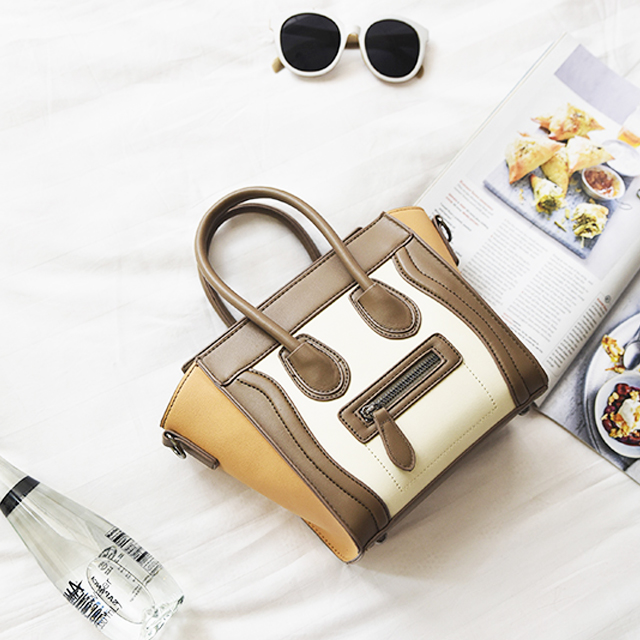 休闲时尚撞色笑脸包